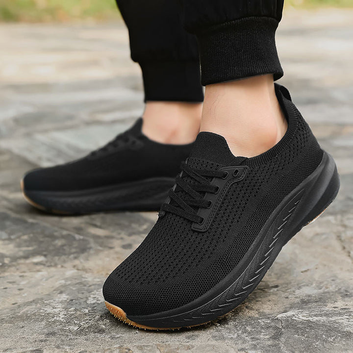 Orthizen Comfort 2.0 Black worn on foot, walking outdoors